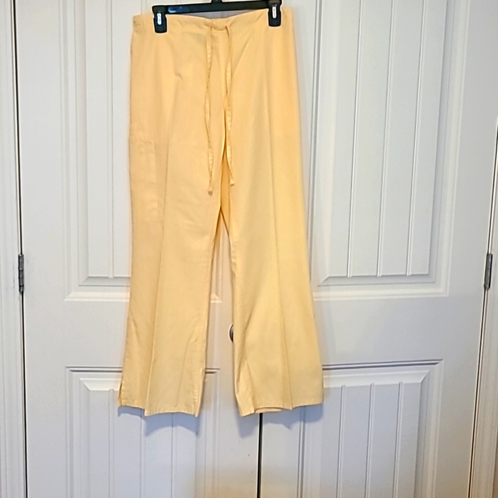 Butter-Soft scrubs by UA. Size-small. Color yellow.